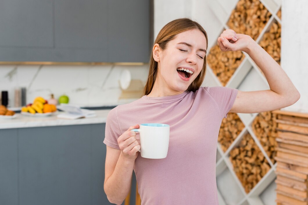 yawning-woman-holding-cup-kitchen_23-2148389954